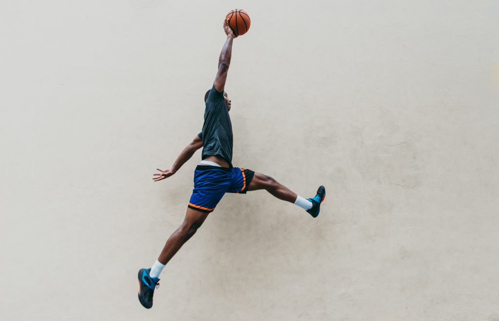 Basketball player training on a court 